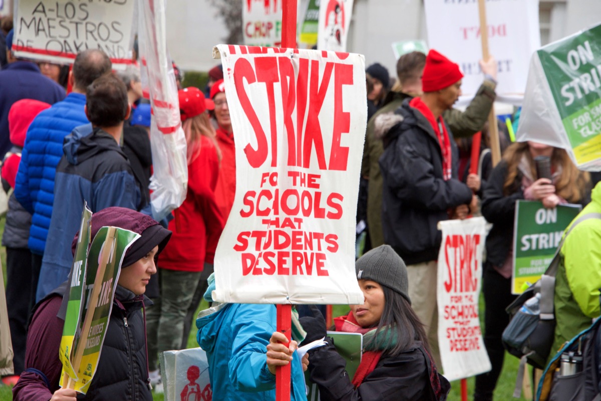 Oakland, CA - February 25, 2019: Unidentified participants at Oakland teachers strike day 3 rallying at Frank Ogawa Plaza. Fighting for smaller class sizes and bigger paychecks. Unions unite concept