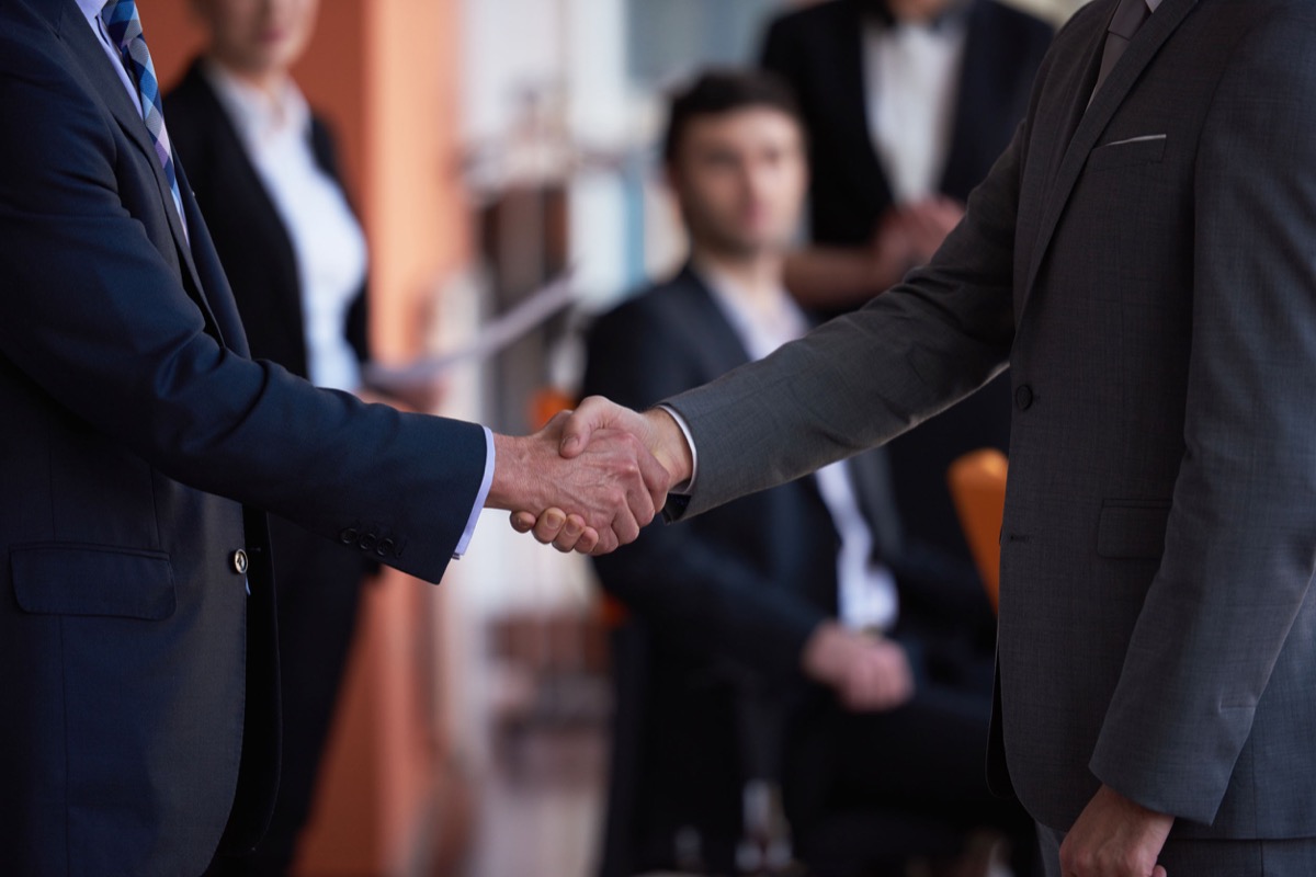 business partners, partnership concept with two businessman handshake