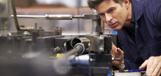 Factory Engineer Operating Hydraulic Tube Bender
