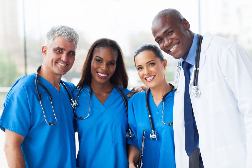 group of happy multiracial medical team in hospital