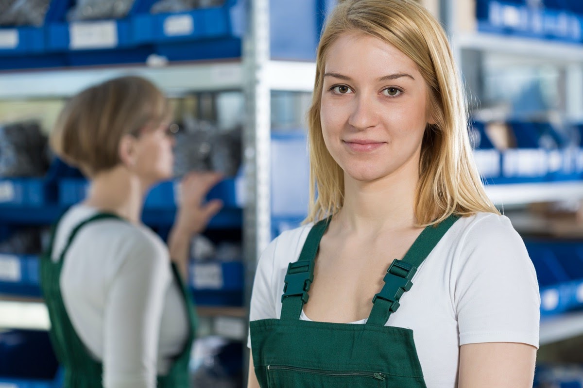 Portrait of young female factory worker; engage younger workers