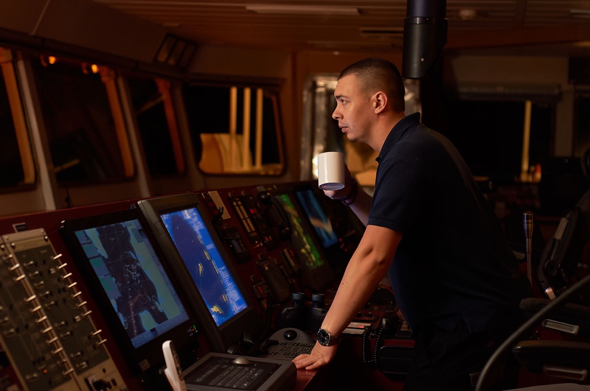 Air traffic controller at console; travel industry workers concept