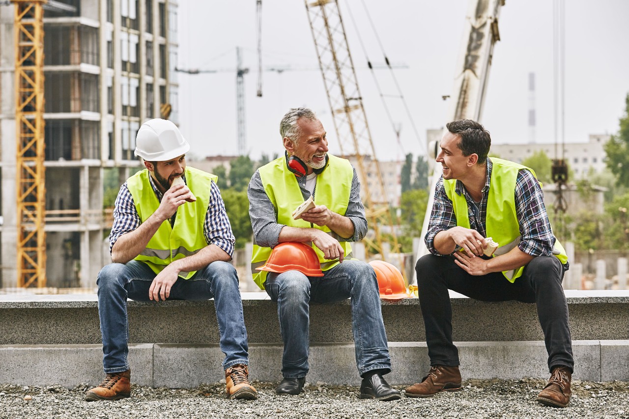 construction workers having lunch; how will the American Jobs Plan impact these workers