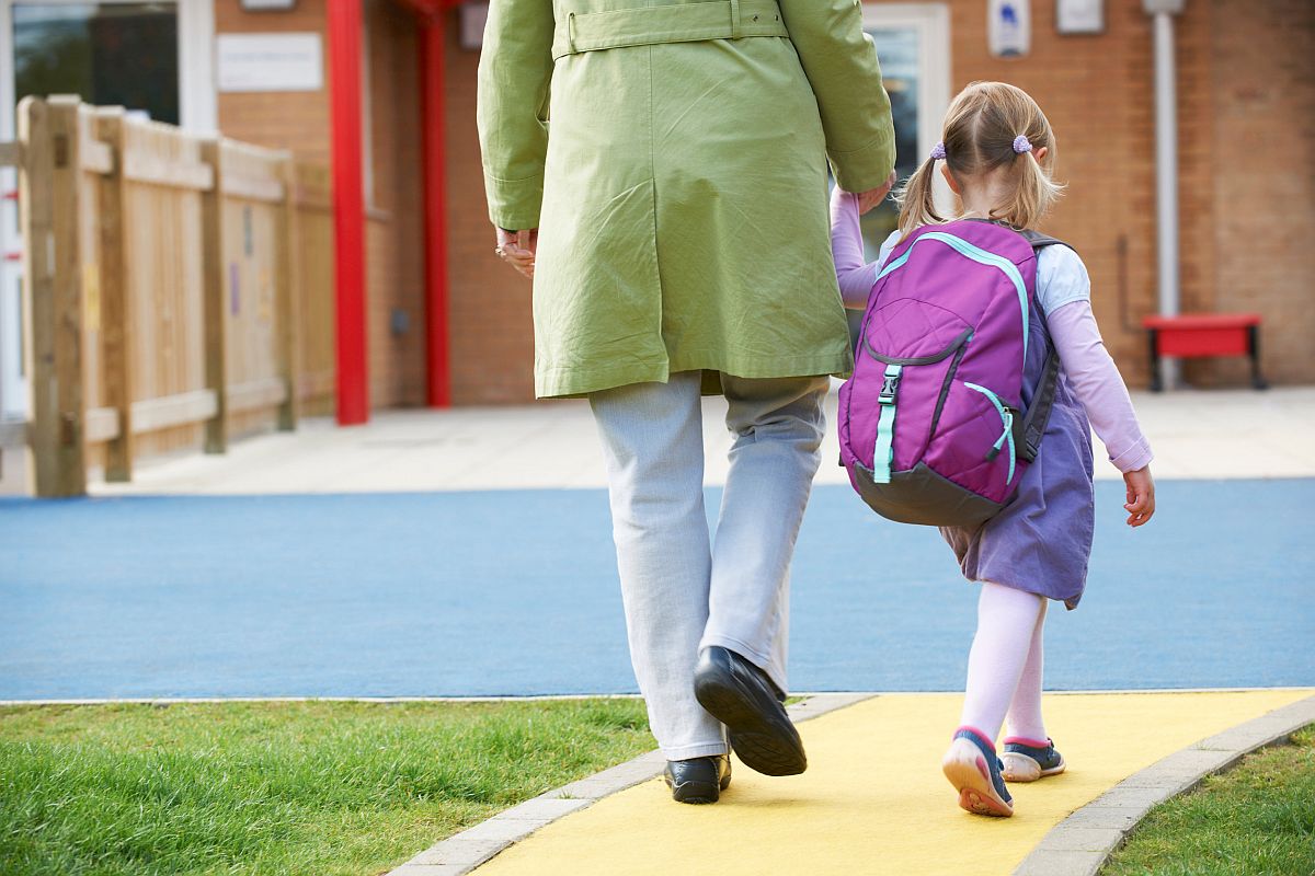 Parent Taking Child To Pre School; concept: the American Families Plan and unions