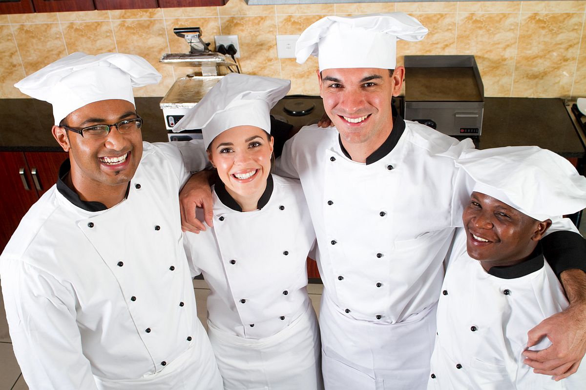 group of young happy chefs in kitchen; Federal Labor Union Task Force concept