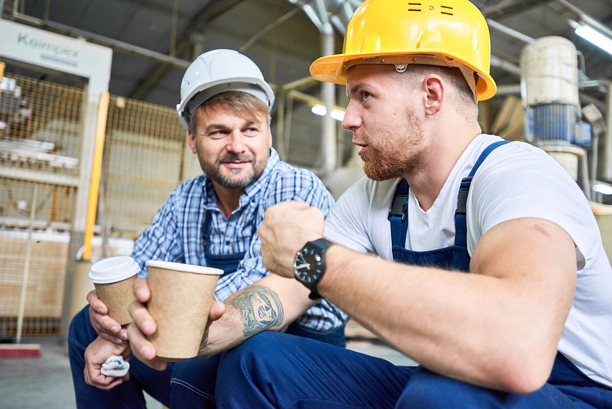 Portrait of two builders wearing hardhats taking break from work, Unionizing Your Workplace concept