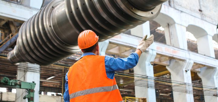 Worker in hard hat in factory; concept next generation of workers