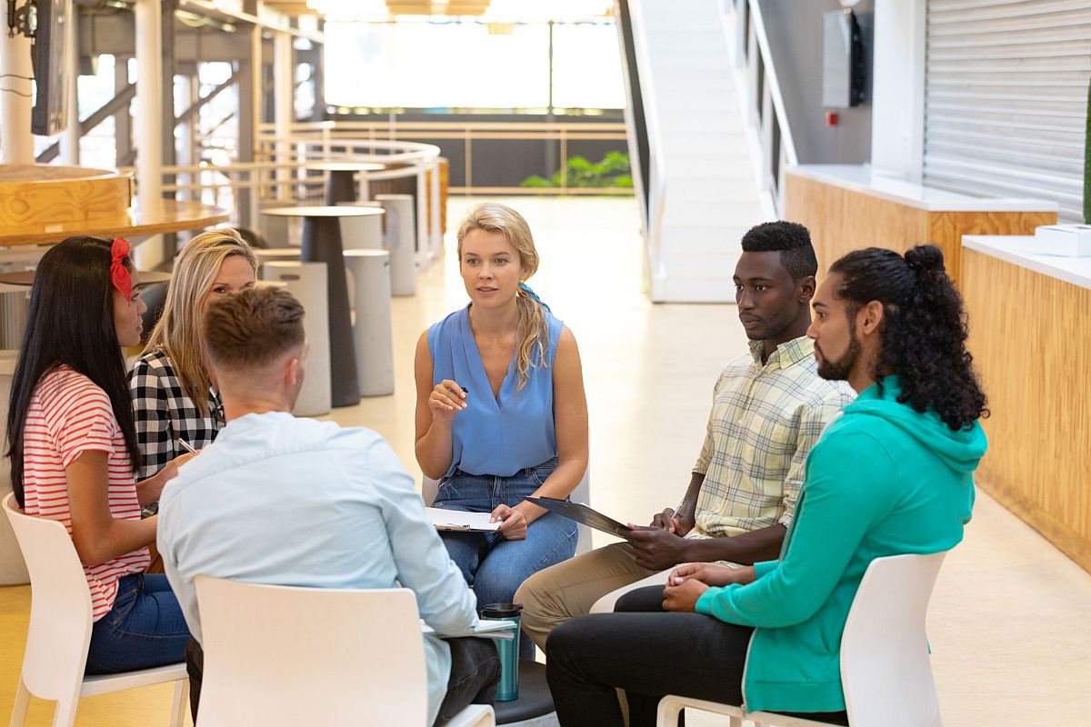 Group of people in circle, having a discussion; new union concept