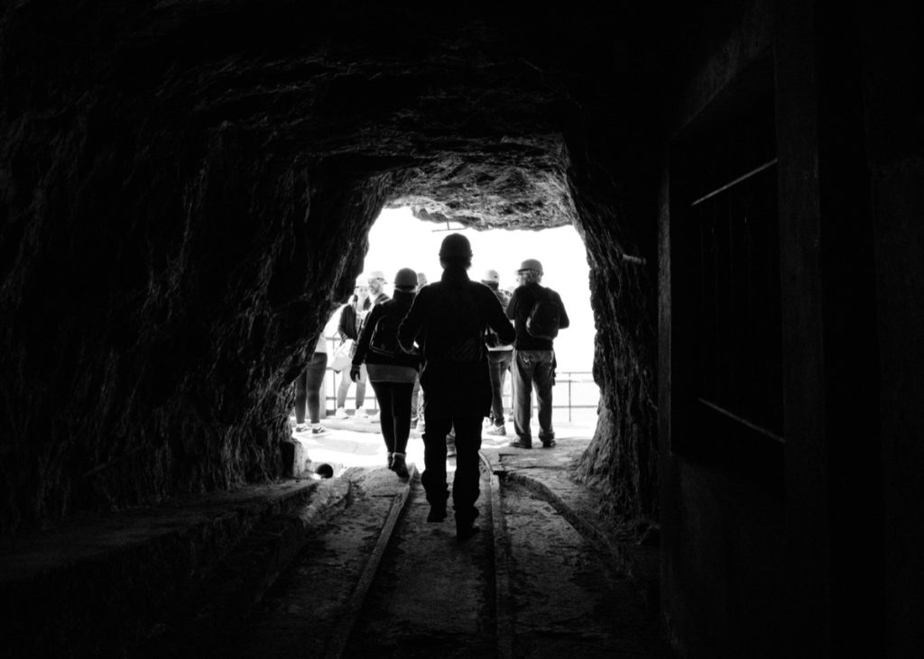 People at entrance to mine; warrior met coal strike concept