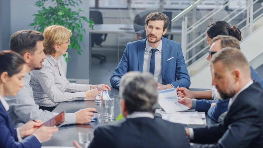 office meeting discuss at table; Fair Contracts concept