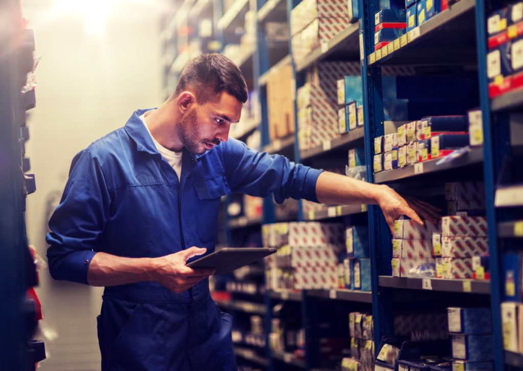 Worker checking inventory; unions impact wages concept