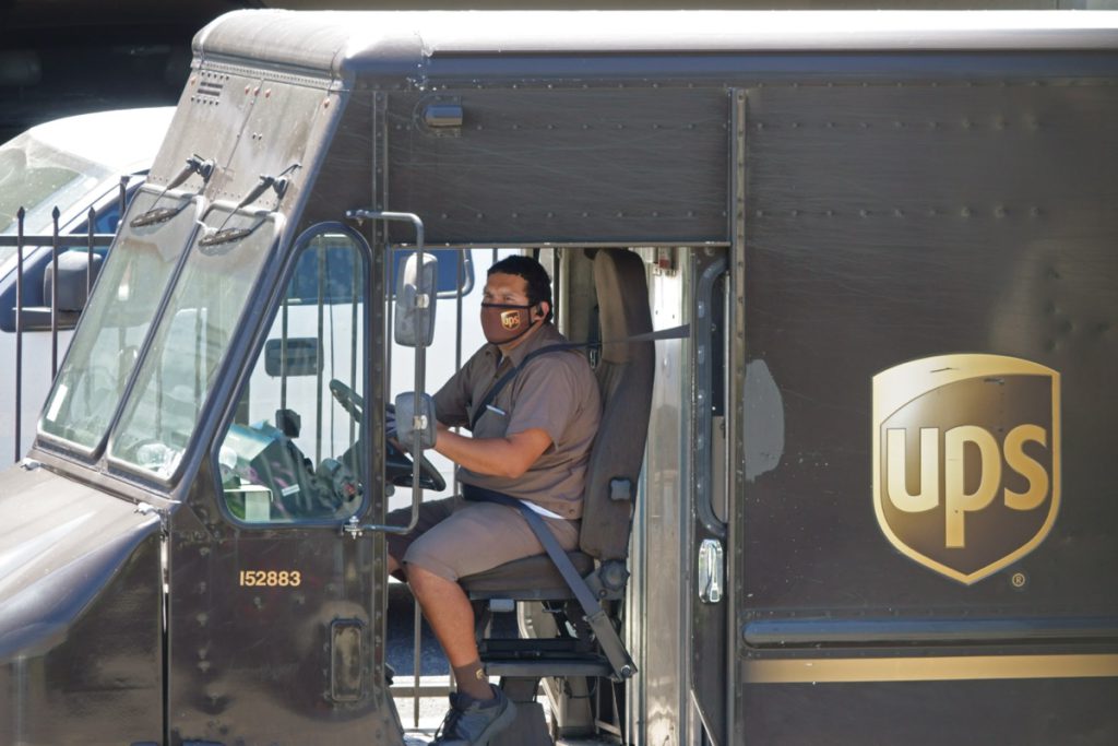 UPS driver in a delivery truck; safer working conditions concept