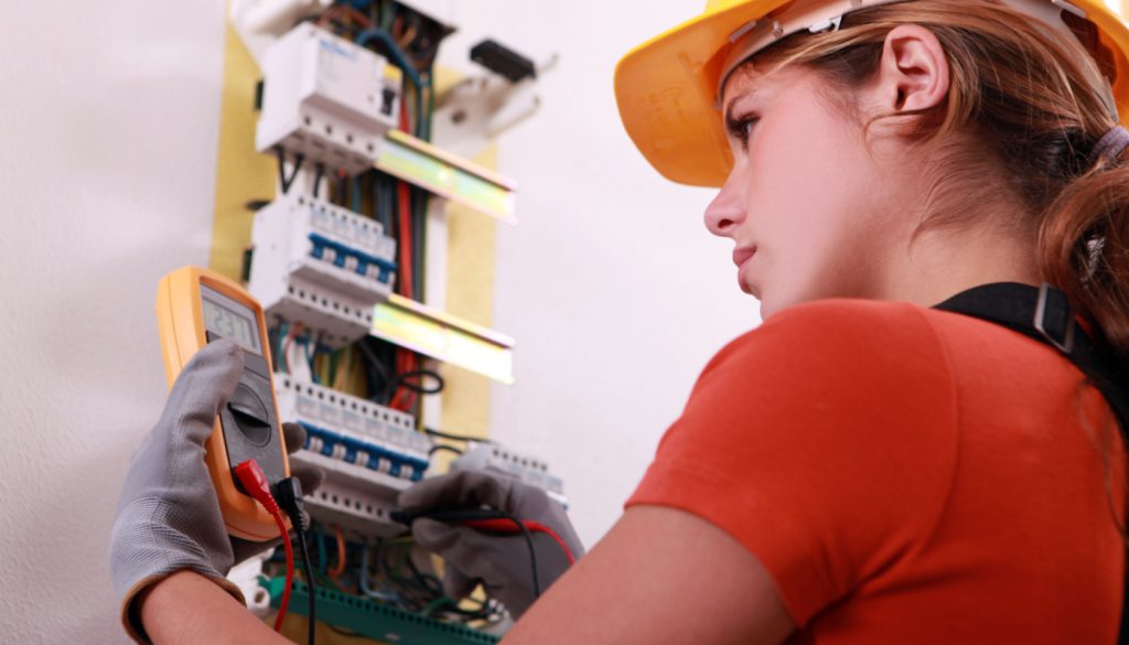 Electrician at work; electrician shortage concept