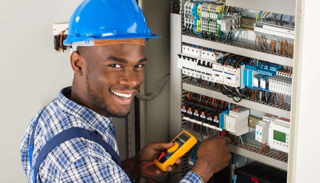 Electrician at work; electrician shortage concept