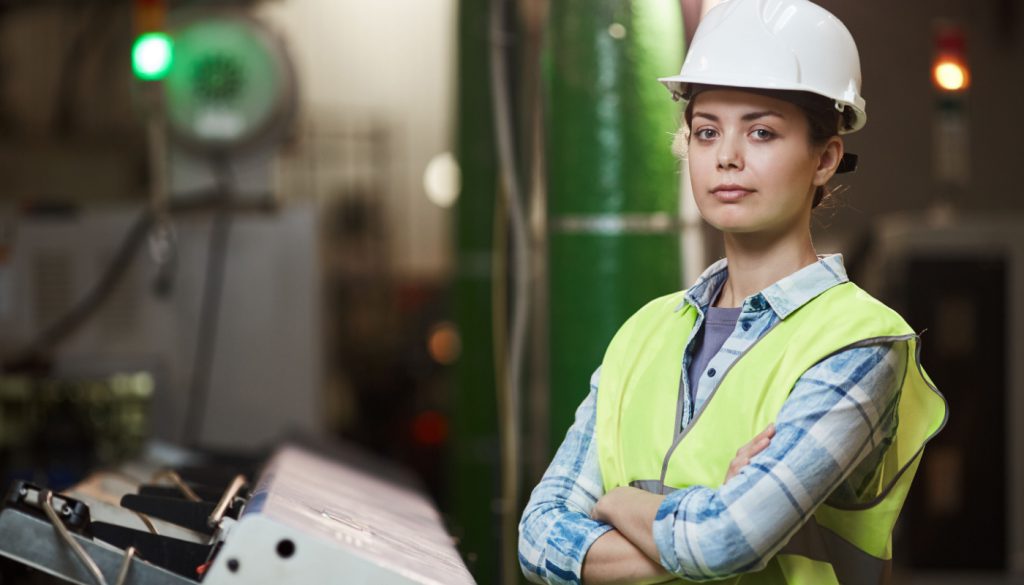 Woman foreman in plant; support workers concept