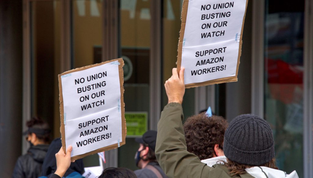 workers protesting Amazon's treatment of employees and their attempts to bust up formation of a union;