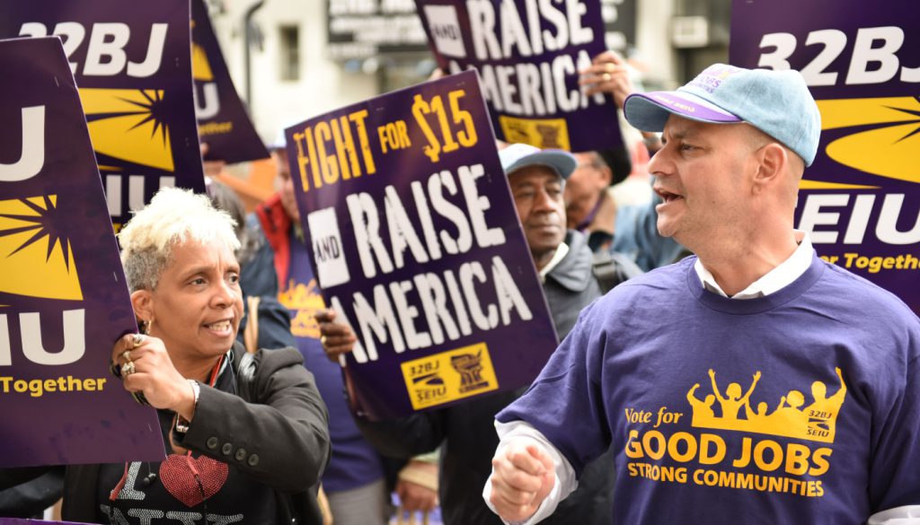 Union and labor activists gathered to urge the NY Wage Board to seek a minimum wage.; union corruption concept