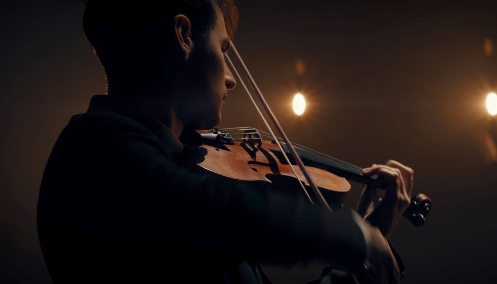 Violinist playing; music industry workers concept
